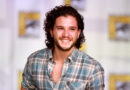 Kit Harington speaking on a panel at San Diego Comic-Con, known for playing Jon Snow in Game of Thrones