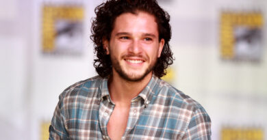 Kit Harington speaking on a panel at San Diego Comic-Con, known for playing Jon Snow in Game of Thrones
