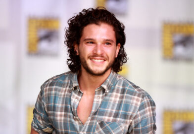 Kit Harington speaking on a panel at San Diego Comic-Con, known for playing Jon Snow in Game of Thrones