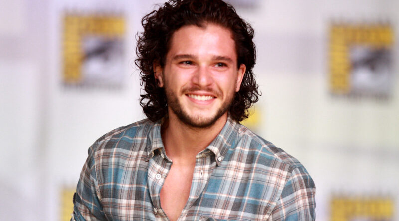 Kit Harington speaking on a panel at San Diego Comic-Con, known for playing Jon Snow in Game of Thrones
