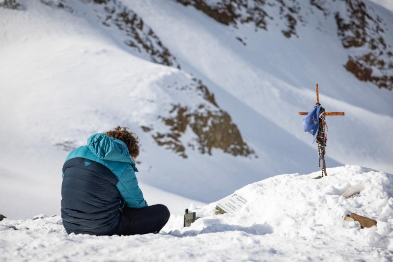 A survivor walking across the snow at the Andes crash site in Beyond Society