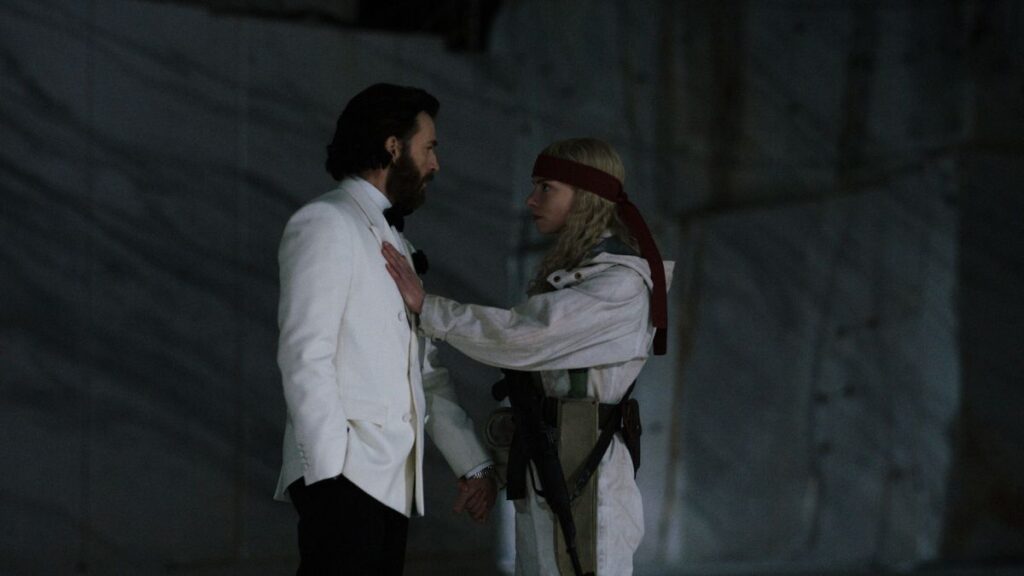 Scene still from Netflix's Sacrifice showing the film's island gala setting