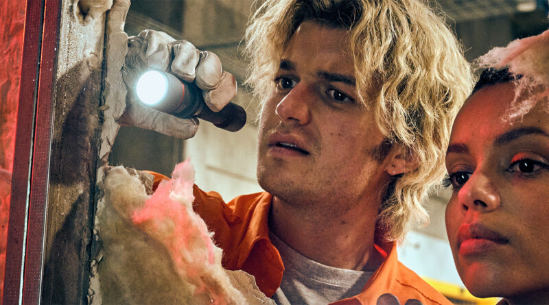 Joe Keery as Teacake and Georgina Campbell as Naomi investigate a wall in Cold Storage