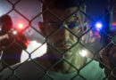 Official Grand Theft Auto VI promotional image of Jason Duval holding a gun as police lights shine behind a fence