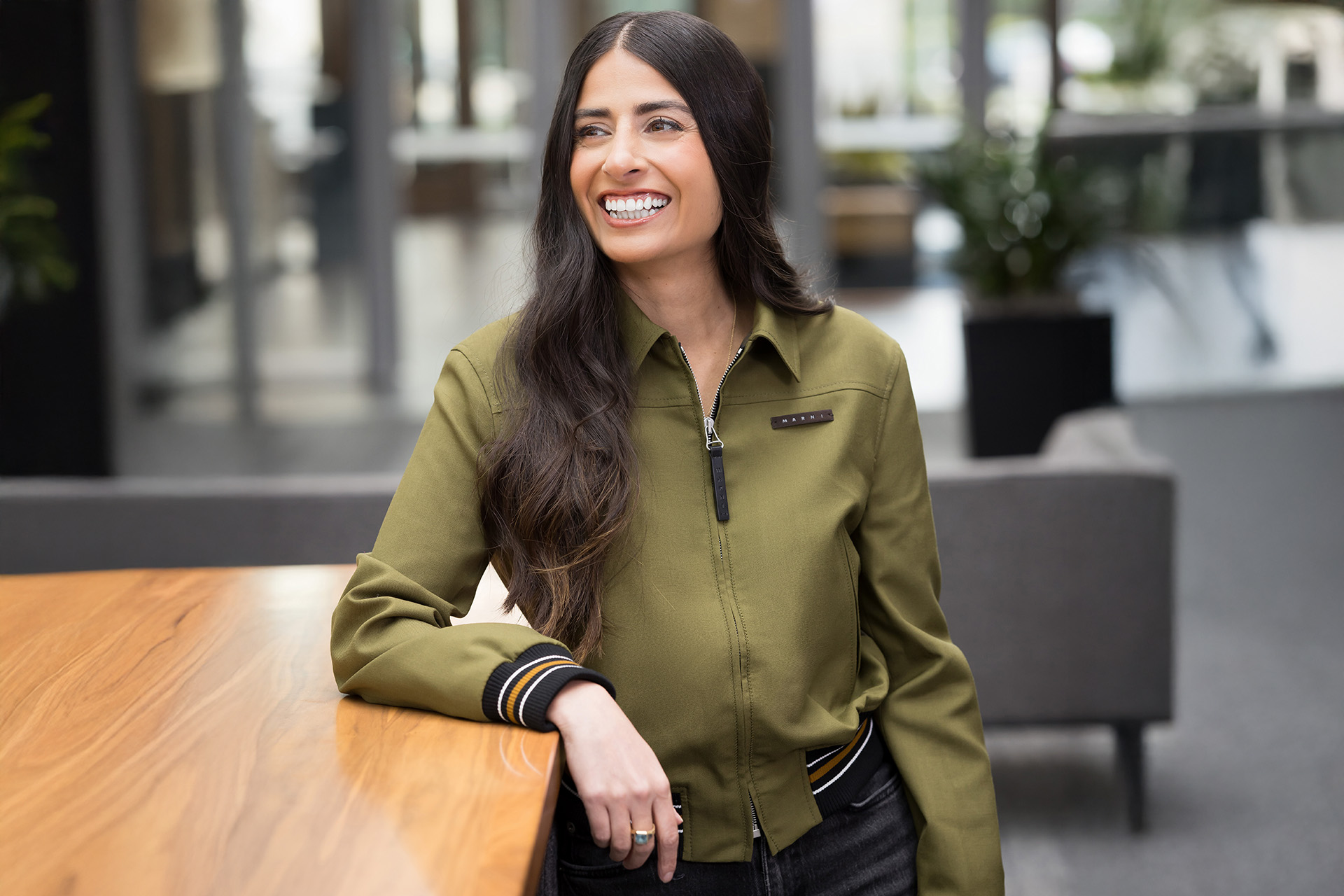 Asha Sharma, CEO of Microsoft Gaming, smiling in an office setting