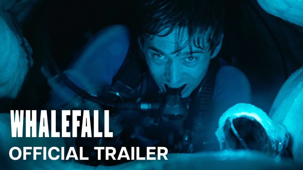 Official trailer still for Whalefall, showing Austin Abrams as Jay Gardiner in scuba gear underwater