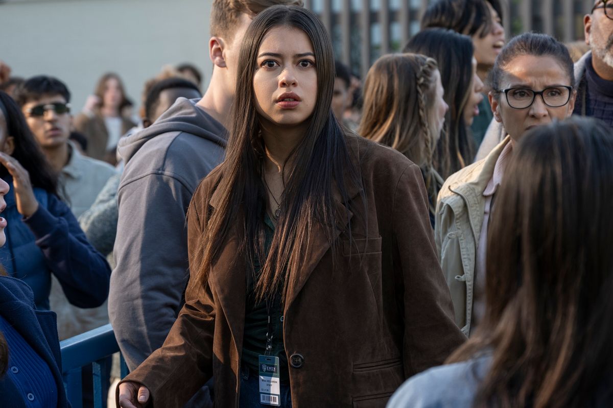 Carrie White surrounded by classmates in a crowd scene from the Prime Video series