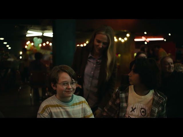 Julie Miller with her son and a family friend in a quiet moment before the horror begins in The Exorcist: Martyrs