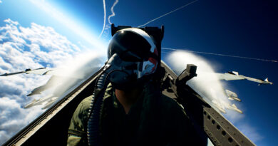A fighter pilot in the cockpit high above the clouds in Ace Combat 8: Wings of Theve