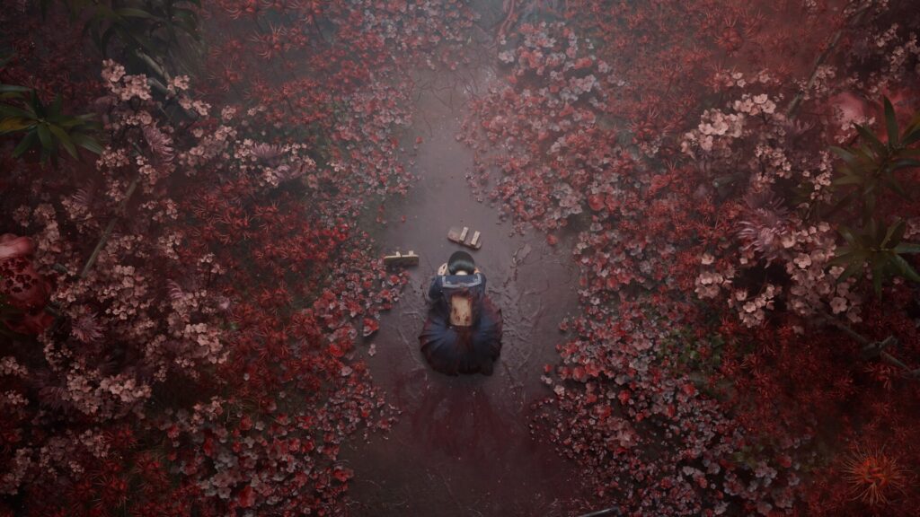 Hinako Shimizu walking through a path overgrown with red flowers in Silent Hill f