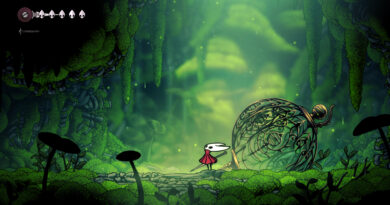 Hornet standing in a lush green mossy cavern in Hollow Knight: Silksong