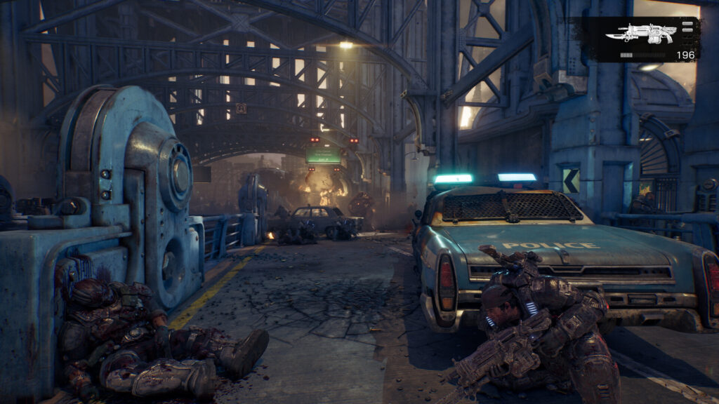 Gears of War E-Day PC graphics settings, a lit industrial street in Kalona with a parked car
