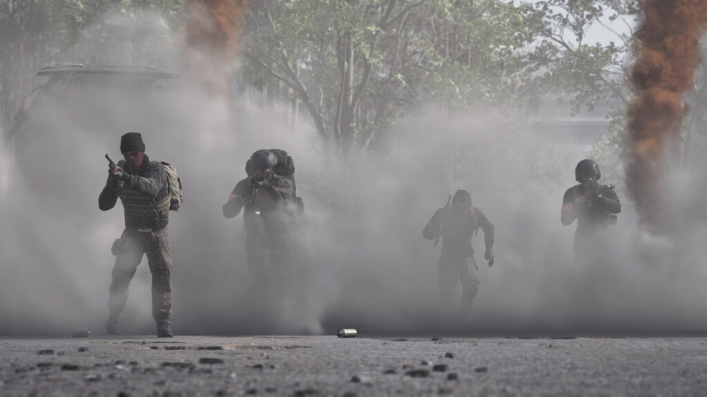 WARDOGS squad advancing through smoke during an assault