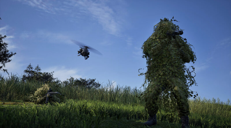 WARDOGS soldier in a ghillie suit watching a helicopter fly over a field