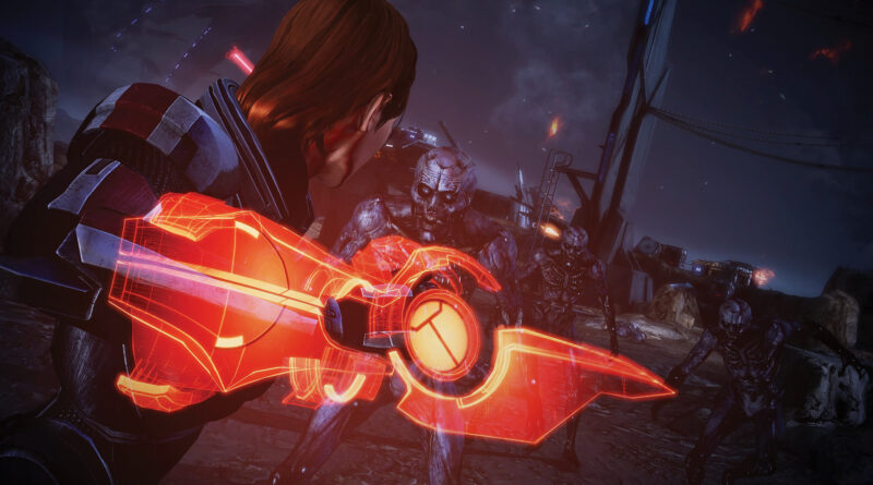 Shepard wielding an Omni-Blade in combat against husks in Mass Effect Legendary Edition