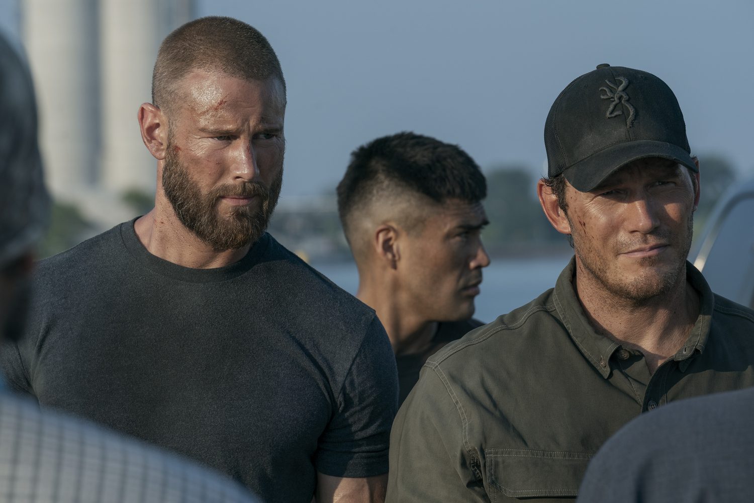 Three members of the special operations team standing together in a scene from The Terminal List Season 2